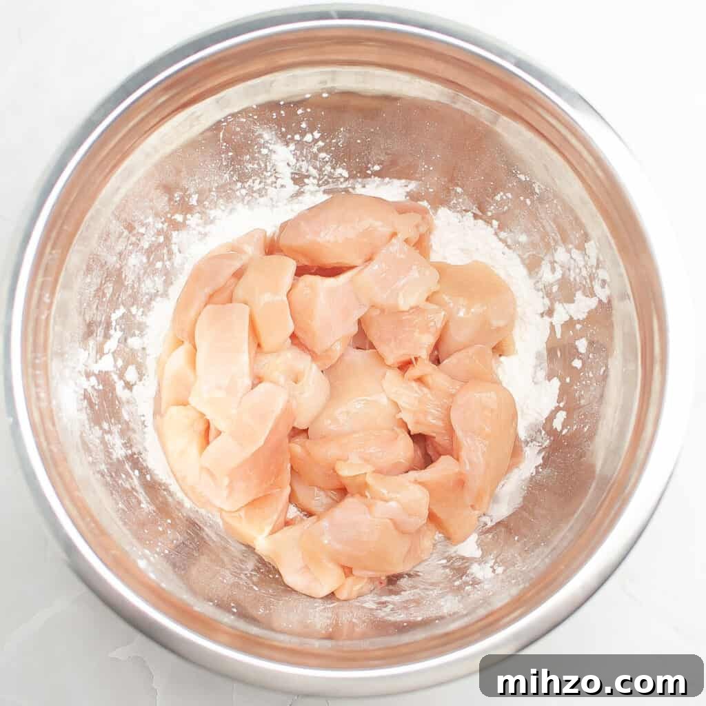 Slow Cooker Teriyaki Chicken Recipe for Tender, Flavorful Meals 4 cubed chicken breast in metal bowl