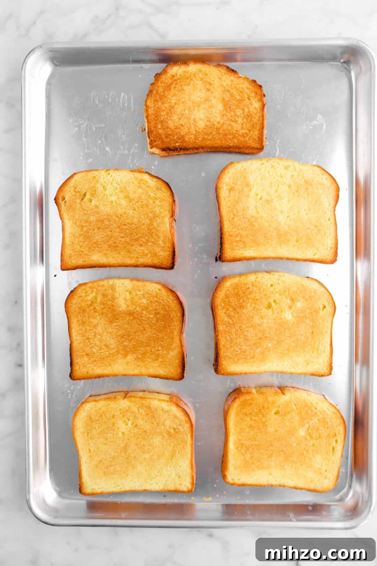 Overnight Gingerbread Chocolate Chip French Toast Bake 11 toasted brioche on sheet pan