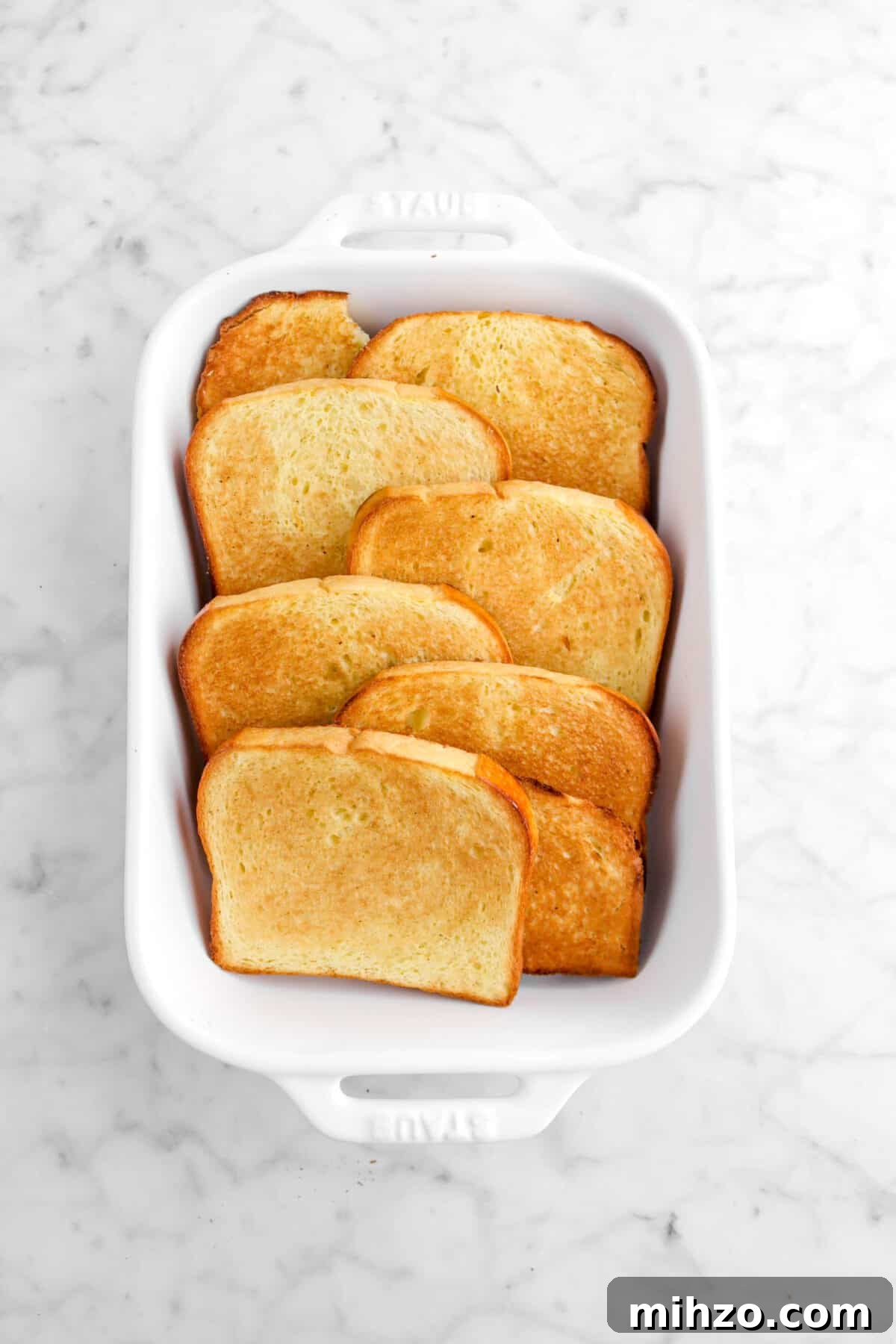 Overnight Gingerbread Chocolate Chip French Toast Bake 12 toasted brioche in white casserole