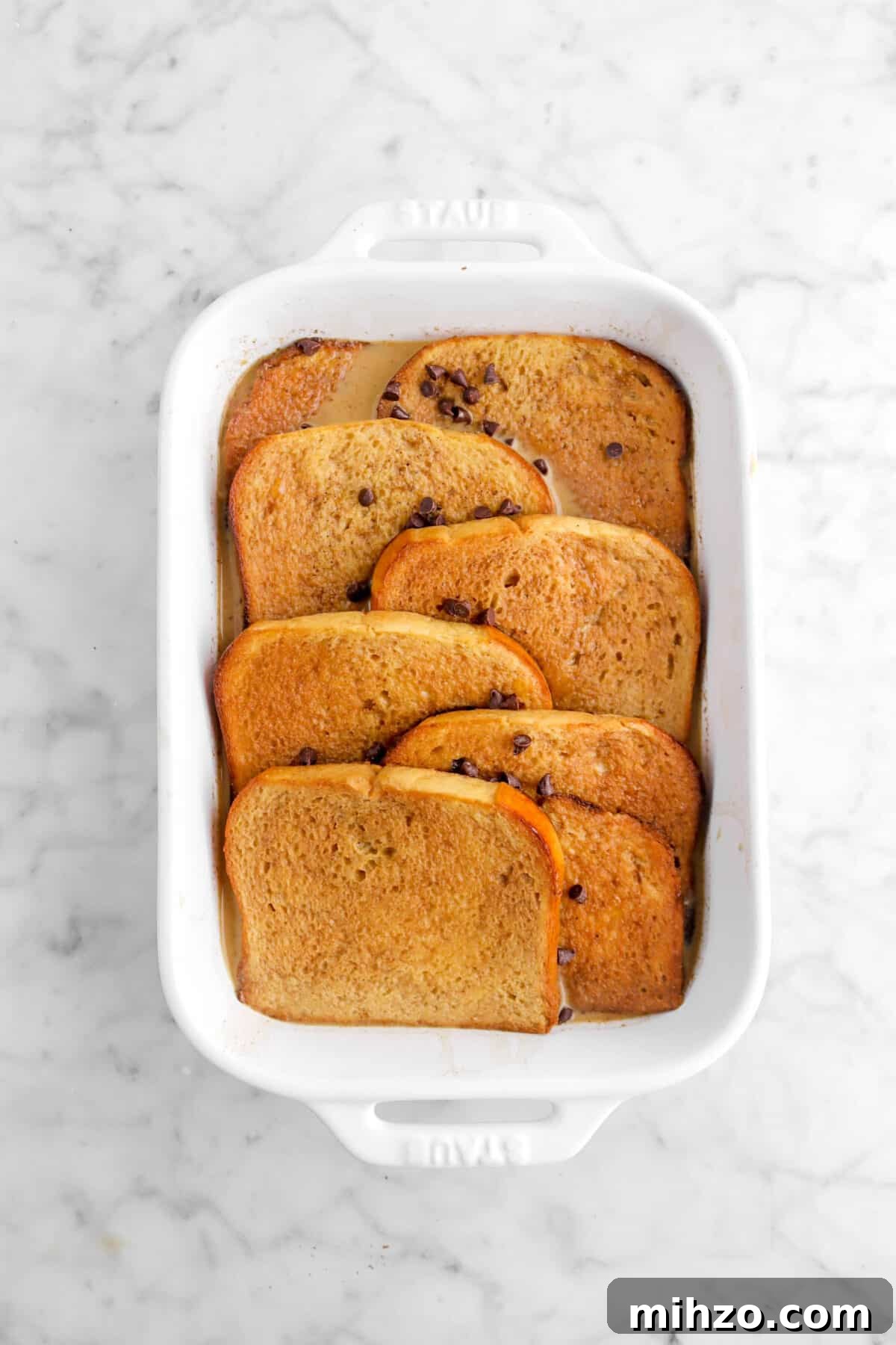 Overnight Gingerbread Chocolate Chip French Toast Bake 15 custard poured over toast