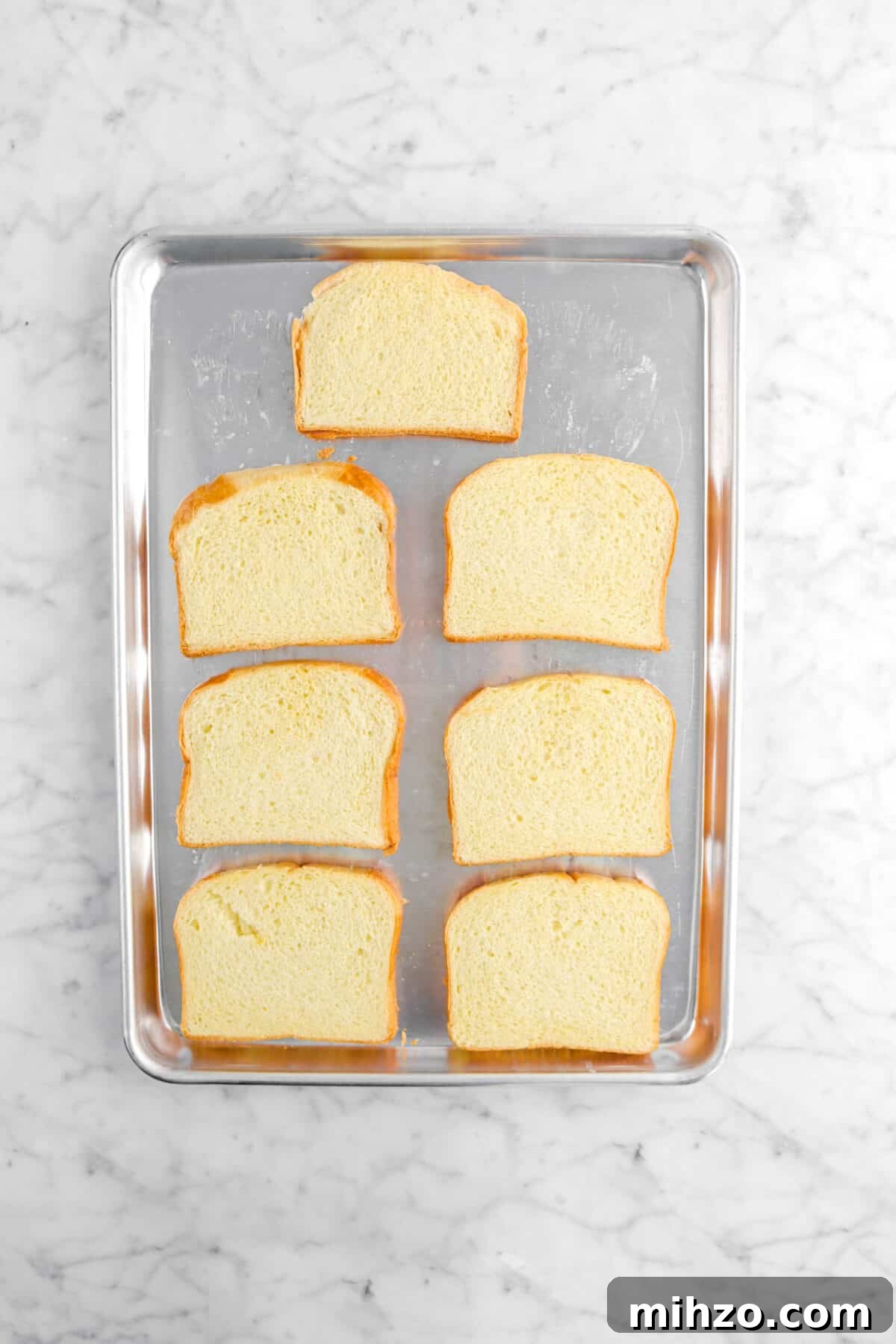 Overnight Gingerbread Chocolate Chip French Toast Bake 10 seven pieces of brioche on sheet pan