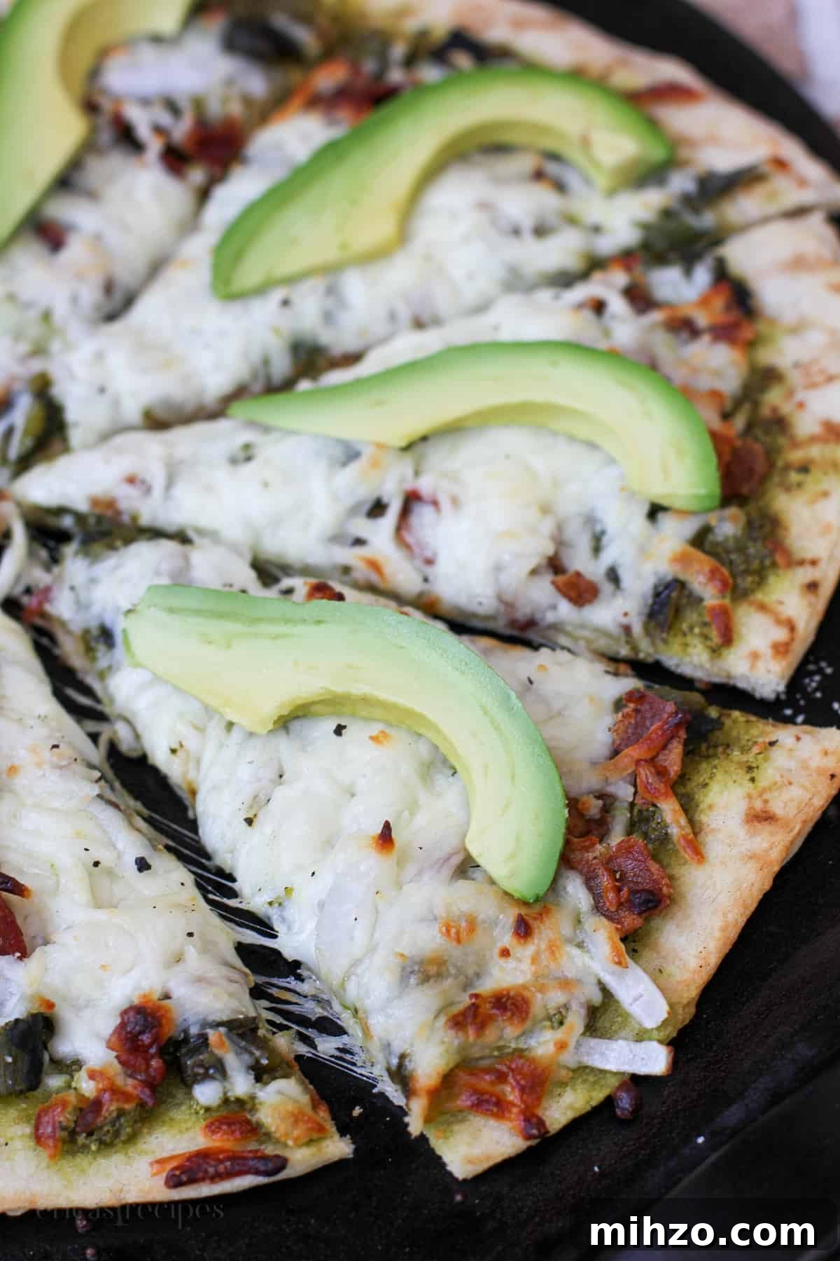sliced pizza on black surface