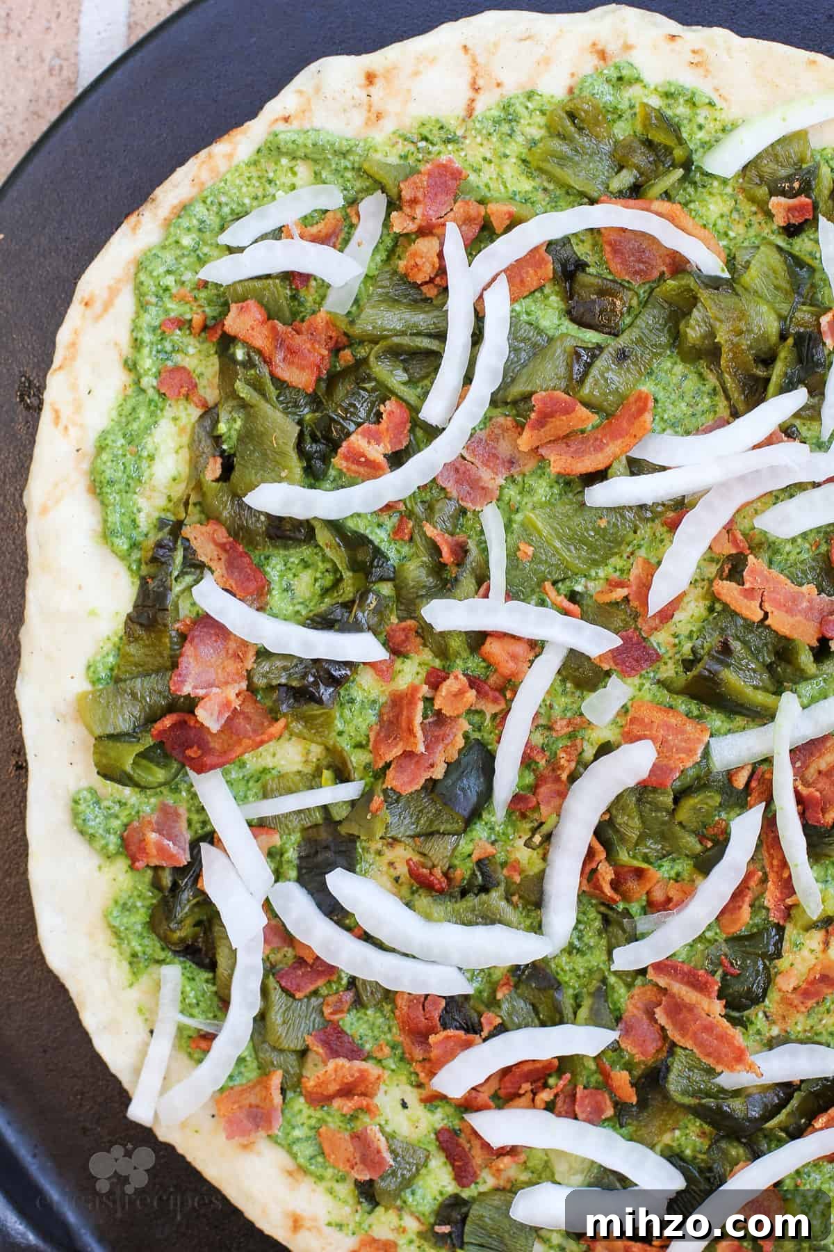 toppings on pizza before adding cheese
