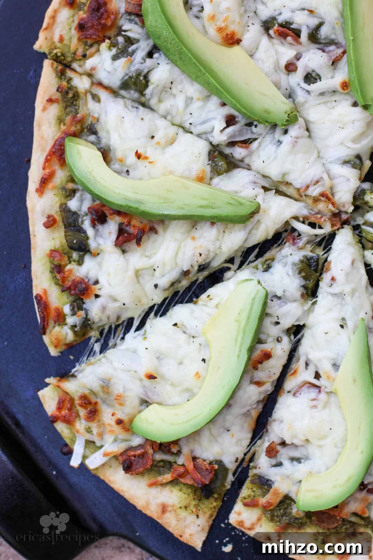 sliced pizza on black surface