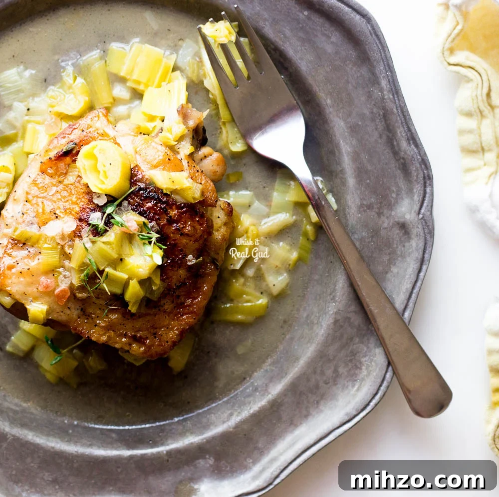 Cider-Braised Chicken with Apples and Thyme 2 braised cider chicken on plate