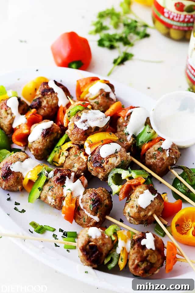 Grilled Turkey Meatball Skewers with Tangy Herb Sauce 5 Turkey meatballs and bell pepper slices on skewers, and drizzled with homemade garlic yogurt sauce.