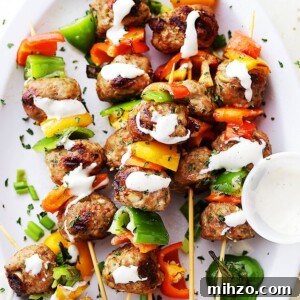 Grilled Turkey Meatball Skewers with Tangy Herb Sauce 7 Turkey meatballs and bell pepper slices on skewers, and drizzled with homemade garlic yogurt sauce.