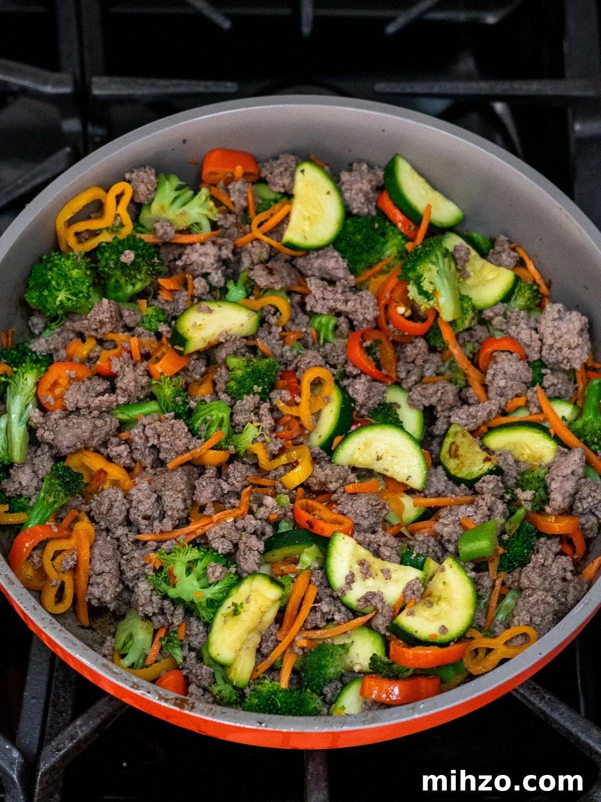 Teriyaki Beef Bowl with Spicy Kimchi Mayo Dressing 6 skillet with stir-fried vegetables and cooked ground beef