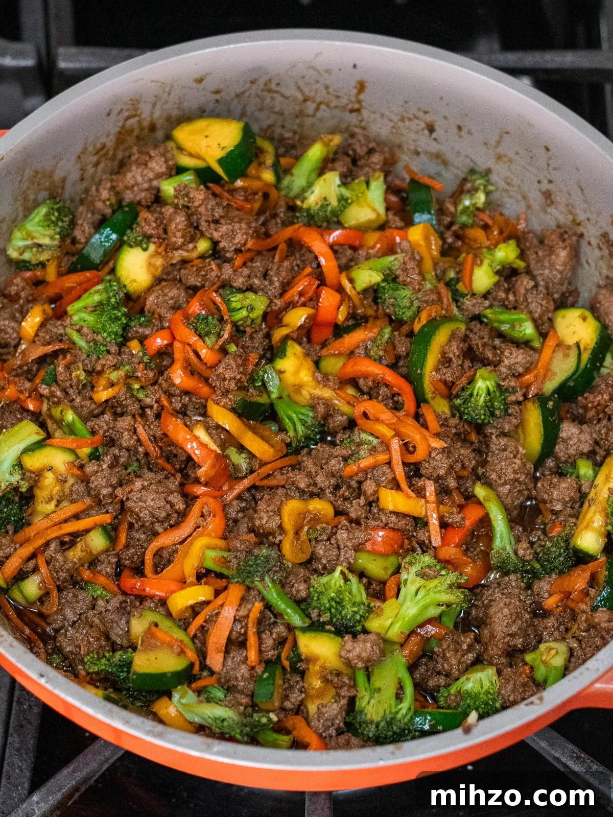 Teriyaki Beef Bowl with Spicy Kimchi Mayo Dressing 7 skillet with stir-fry vegetables, ground beef and teriyaki sauce