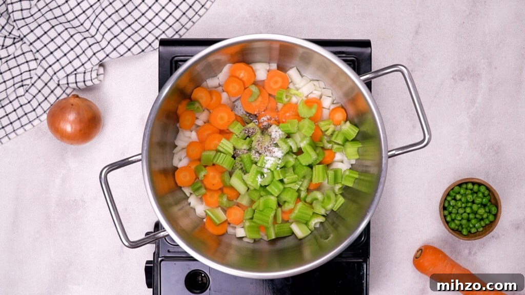 Gluten-Free Soup Dumplings Recipe: How to Make Juicy Xiao Long Bao 9 Chopped carrots, celery, and onions added to a new pot.