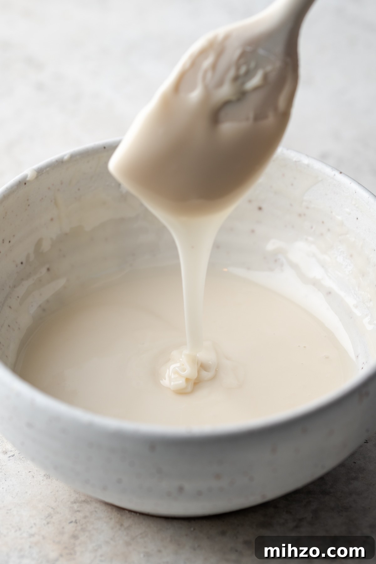 Gluten-Free Black and White Cookies Recipe: Classic New York Treat 6 White fondant icing in a bowl.