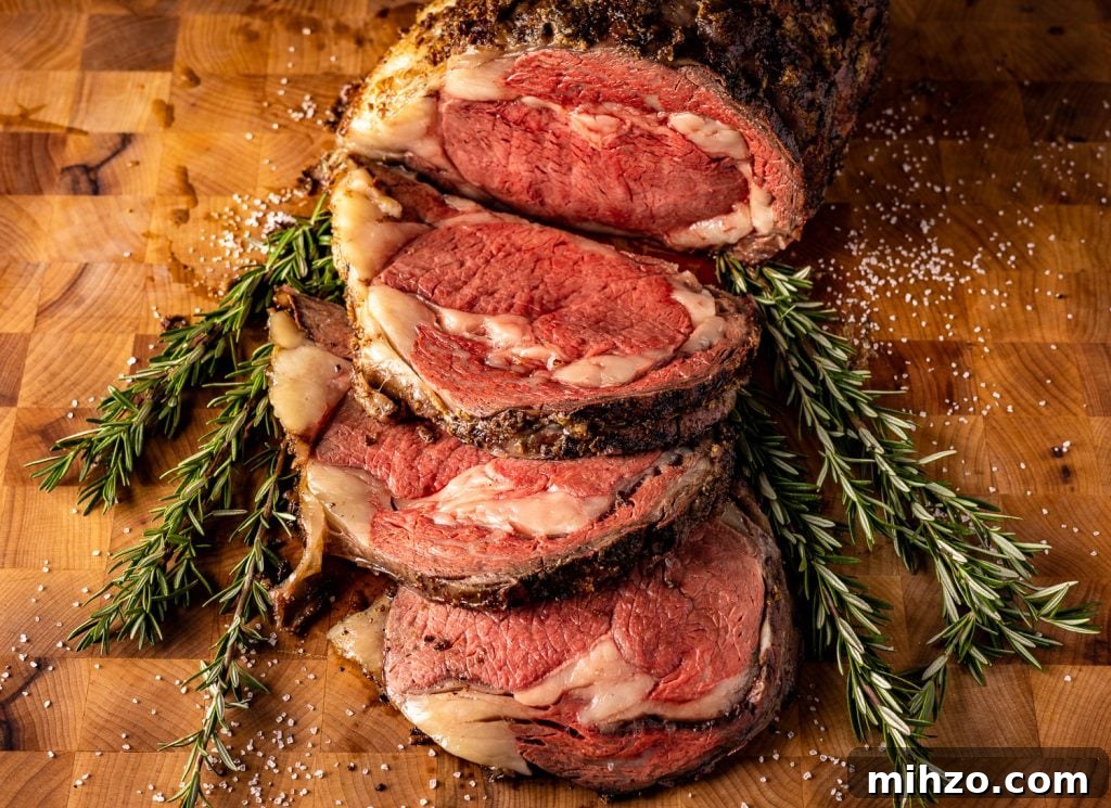 Smoked Prime Rib Roast Recipe for Tender, Juicy Results 7 Sliced prime rib roast on a bed of fresh herbs.