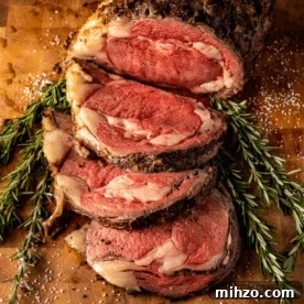 Smoked Prime Rib Roast Recipe for Tender, Juicy Results 8 Sliced prime rib roast on a bed of fresh herbs.