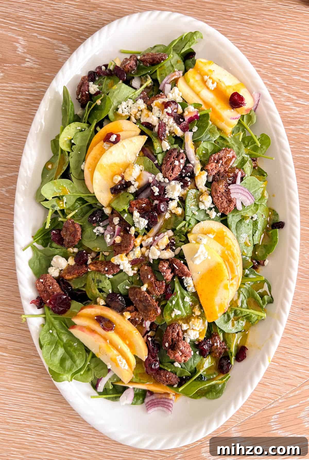 Autumn Apple Salad with Candied Pecans and Maple Vinaigrette 2 Overhead shot of fall apple pecan salad with spinach.