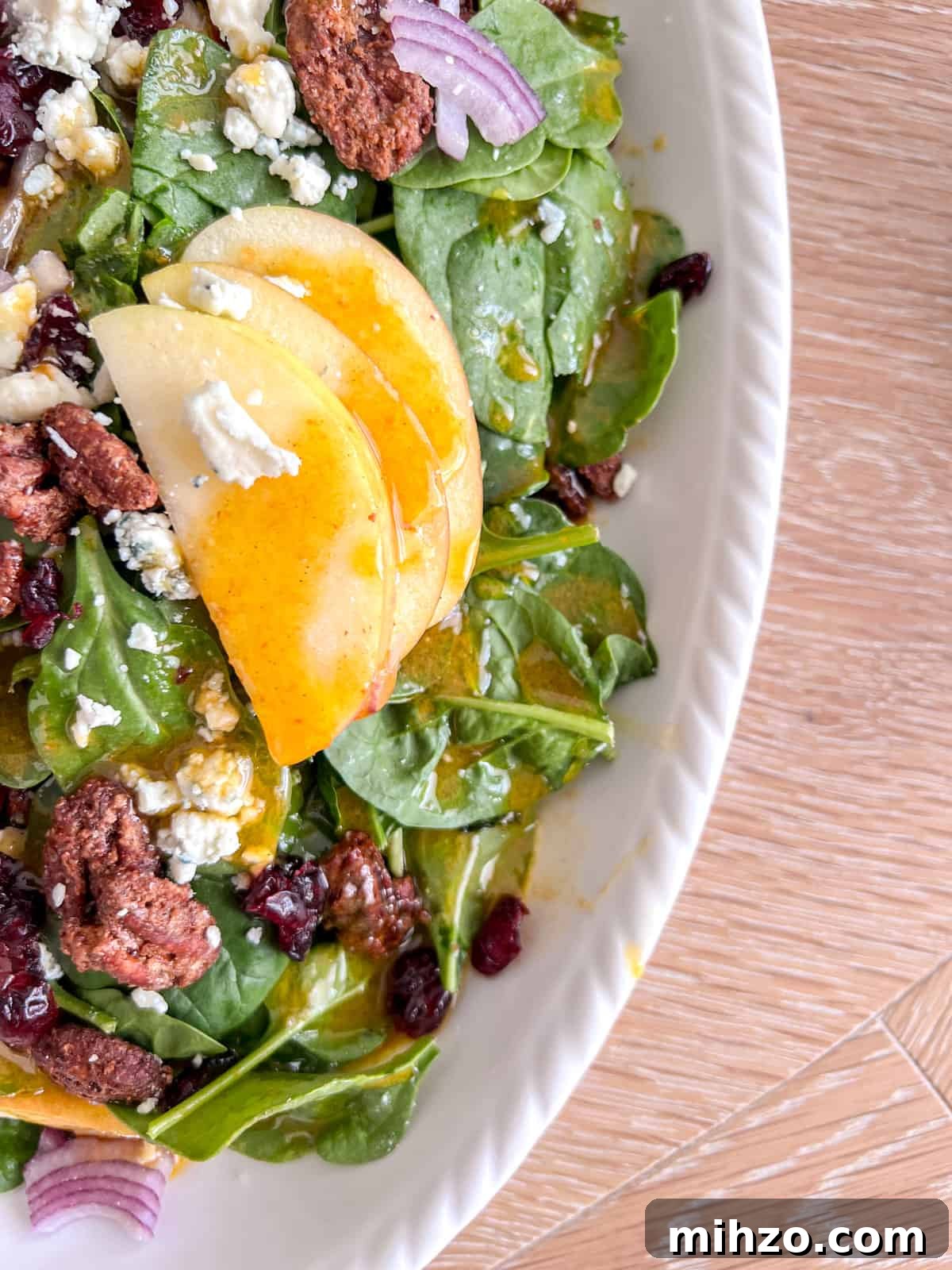 Autumn Apple Salad with Candied Pecans and Maple Vinaigrette 3 Close up shot of apple pecan salad.
