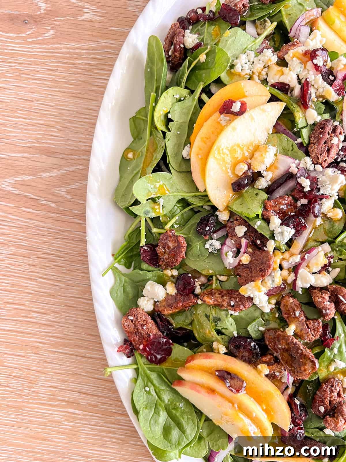 Autumn Apple Salad with Candied Pecans and Maple Vinaigrette 6 Fall salad on a white plate.