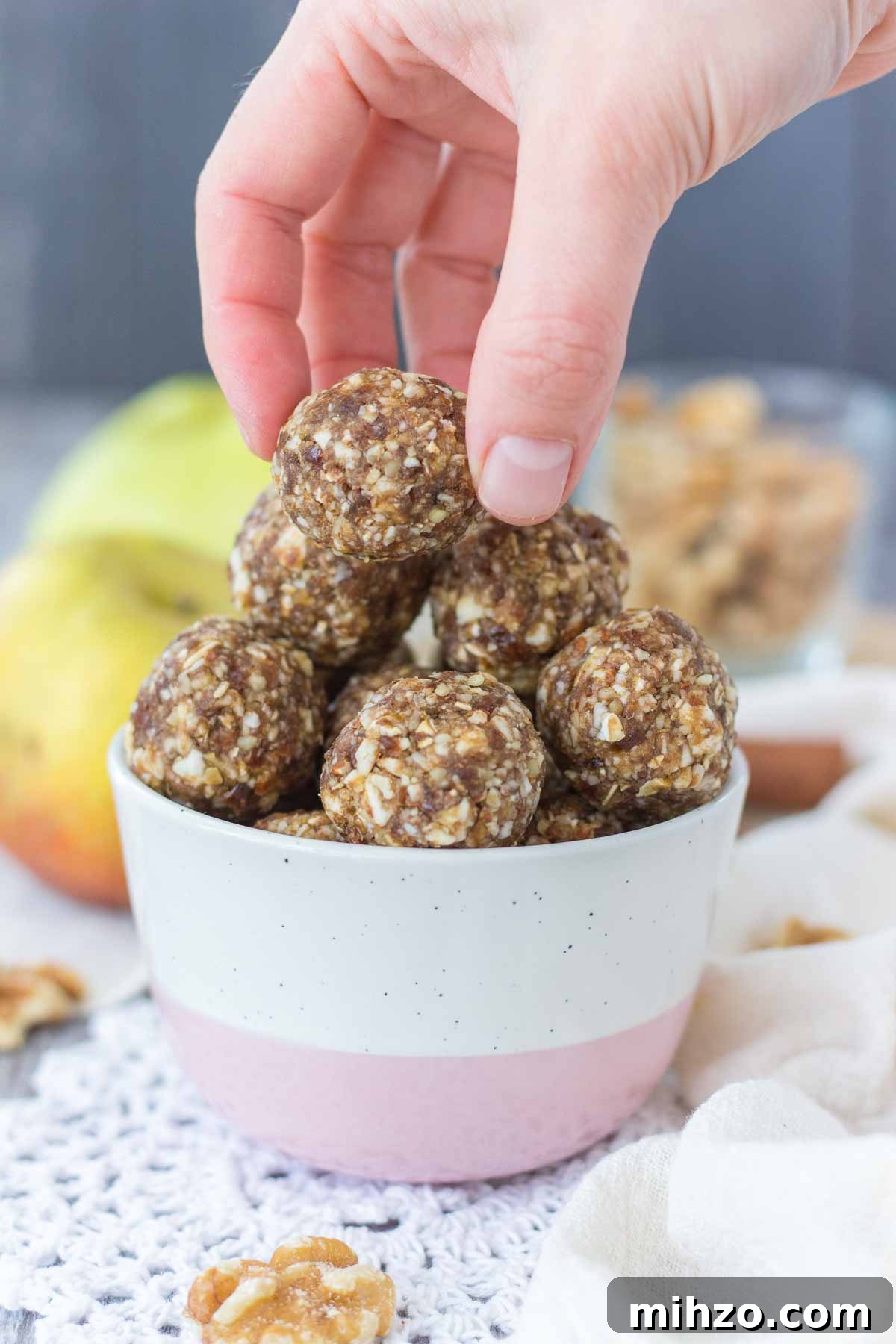 Hand taking Apple Pie Energy Bites