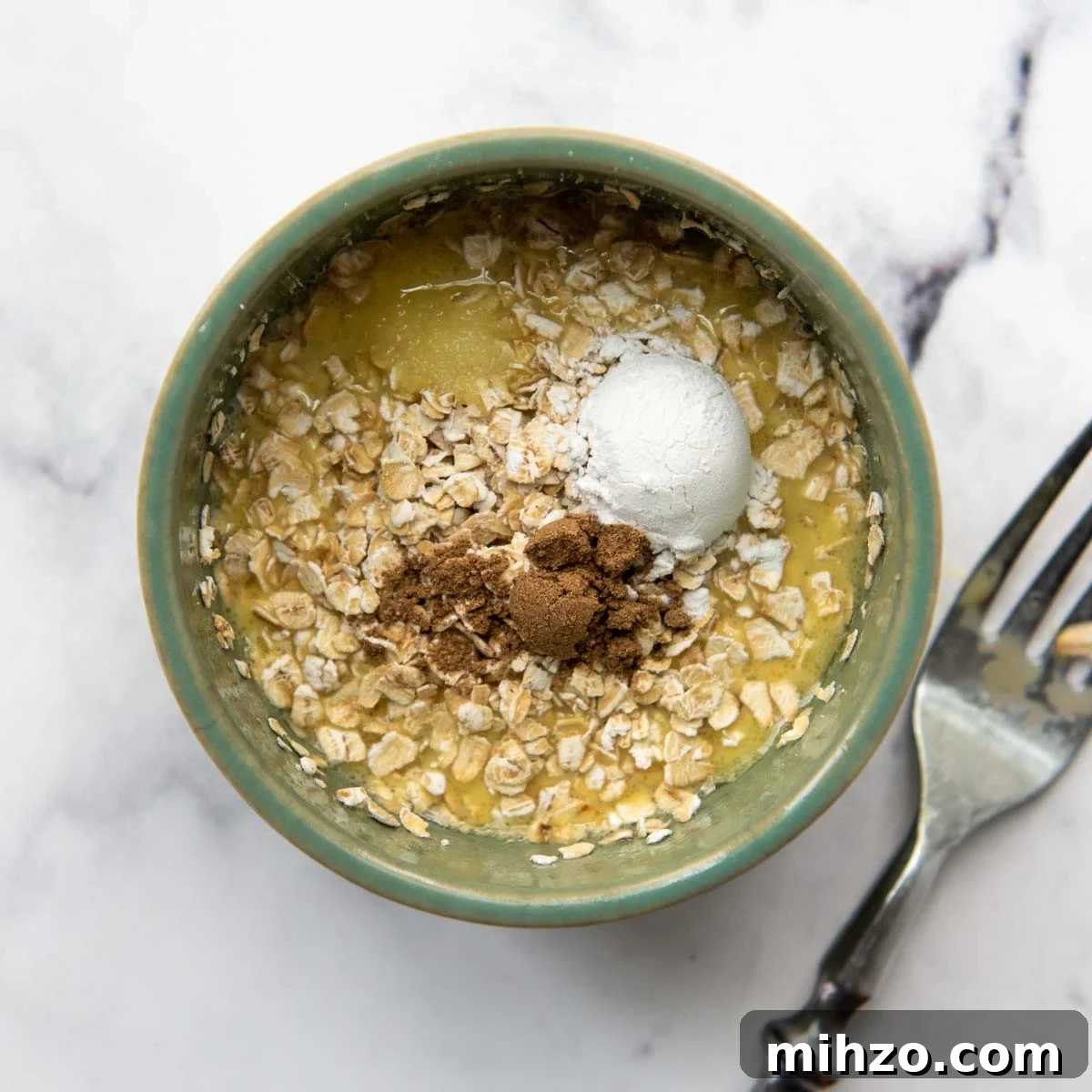 Fluffy 2-Minute Oatmeal Mug Cake — No Flour Mug Cake 4 adding the dry ingredients to the recipe.
