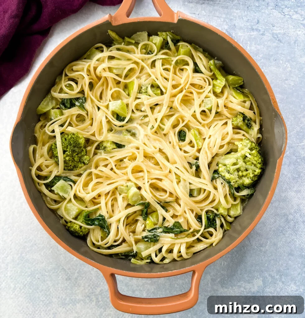 Lemon Garlic Chicken Pasta with Creamy Parmesan Sauce 13 lemon pasta in a pan with spinach and broccoli