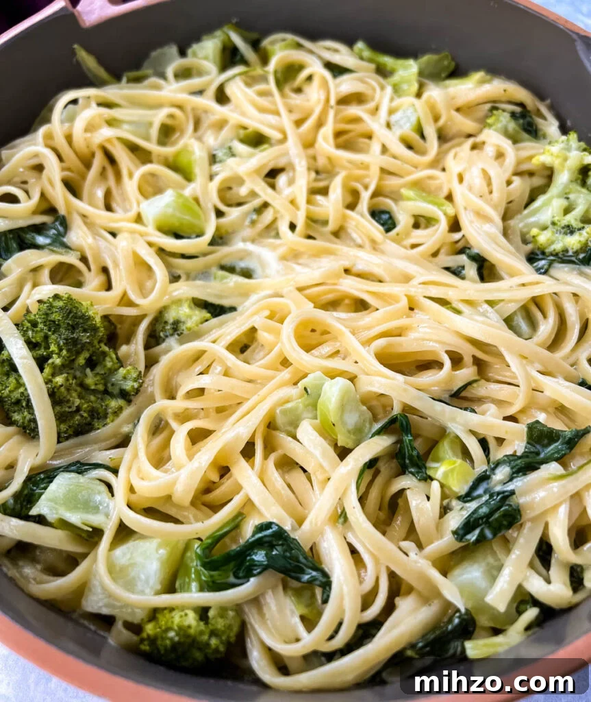 Lemon Garlic Chicken Pasta with Creamy Parmesan Sauce 14 lemon pasta in a pan with spinach and broccoli