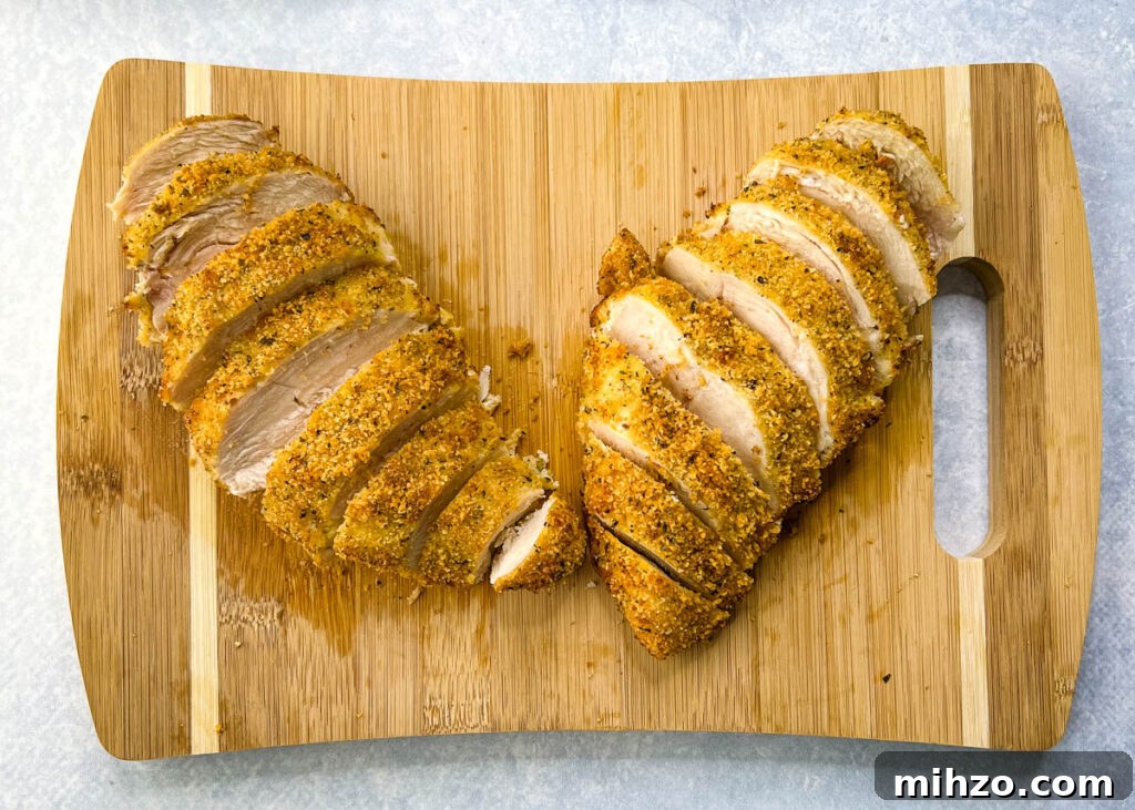 Lemon Garlic Chicken Pasta with Creamy Parmesan Sauce 8 parmesan breaded chicken sliced on a cutting board