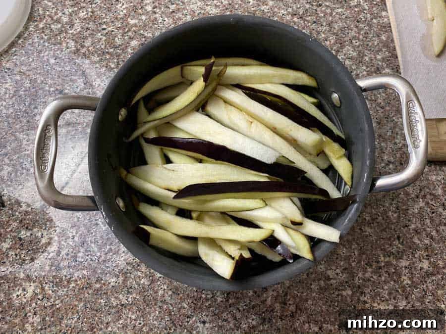 Eggplant slices in colander