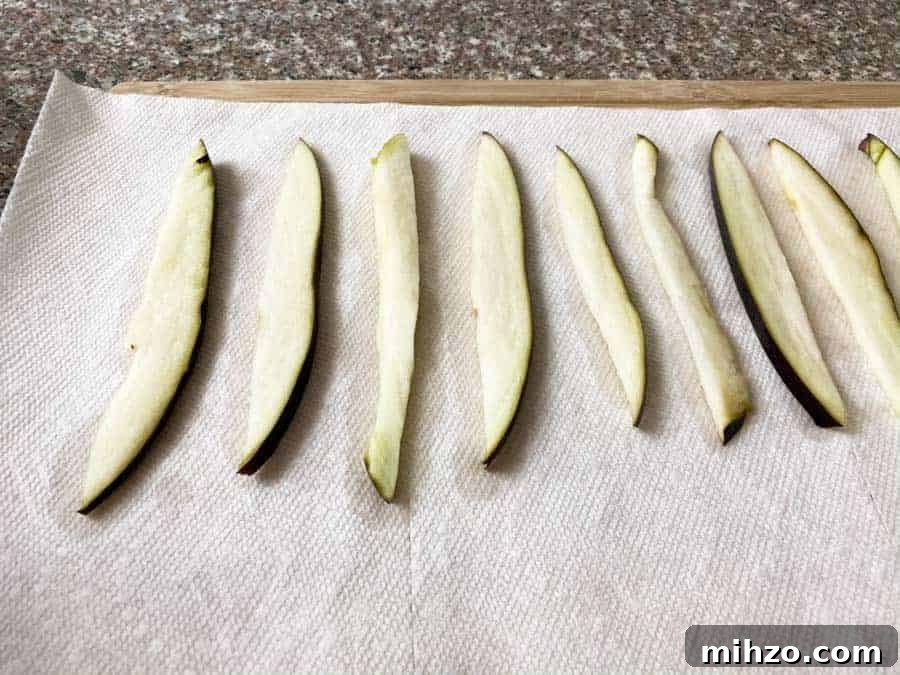 wet Eggplant slices on paper towel