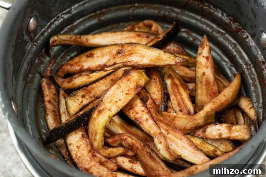Marinded Eggplant slices in colander
