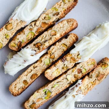 Gluten-Free Pistachio Biscotti Recipe for Crispy, Nutty Treats 11 Pistachio biscotti on a plate.