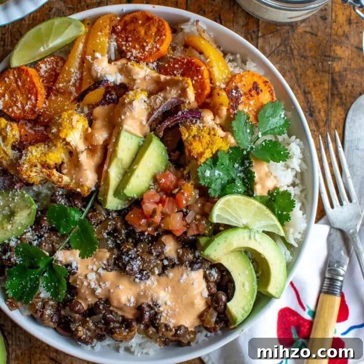A healthy vegetarian burrito bowl next to a jar of Cotija cheese