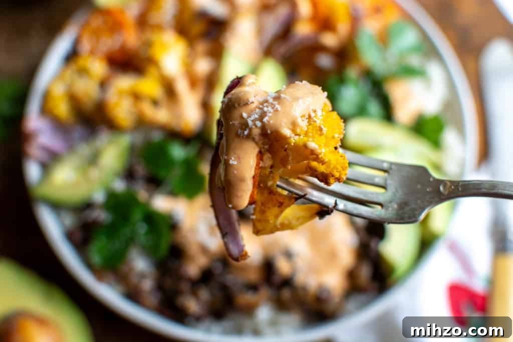 Protein-Packed Vegetarian Black Bean Burrito Bowl Recipe 3 A close up of roasted cauliflower from the vegetarian burrito bowl.