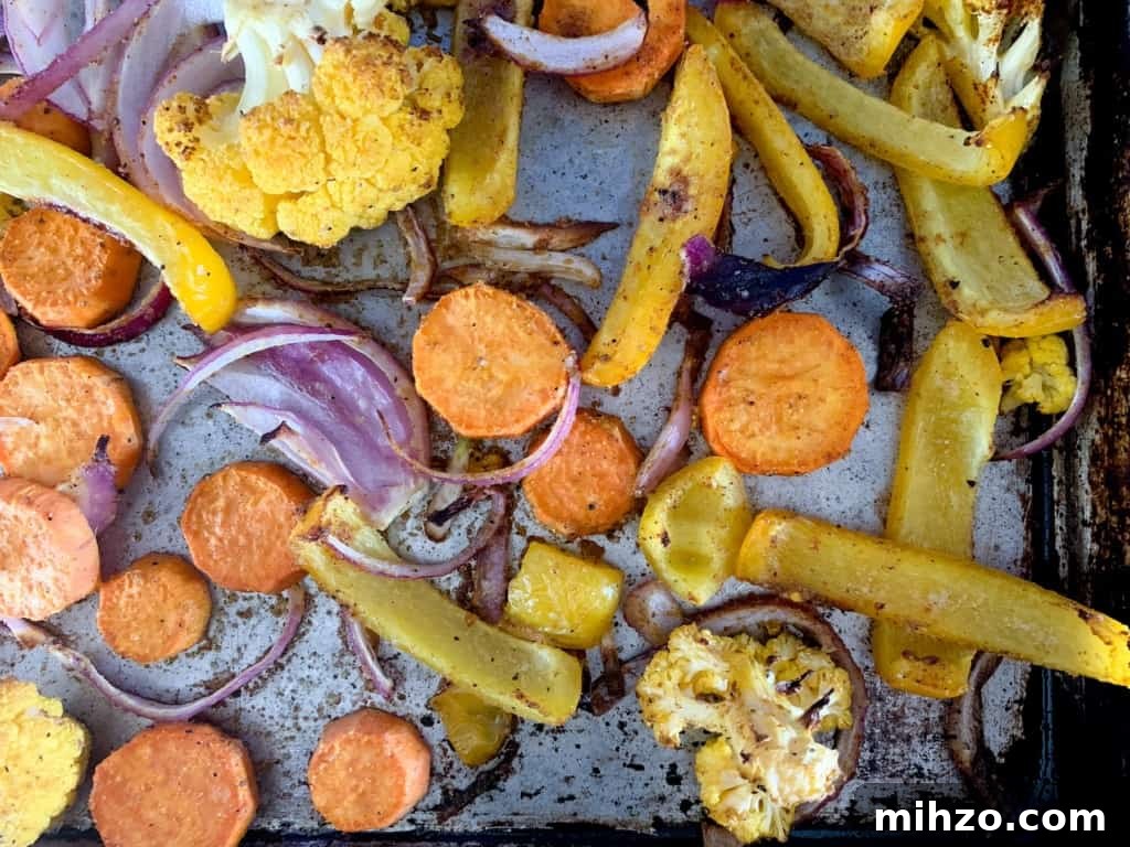 Protein-Packed Vegetarian Black Bean Burrito Bowl Recipe 8 All the veggies after being roasted on a baking sheet.