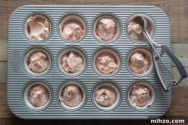 Prepping Fresh Strawberry Cupcakes with Strawberry Buttercream 