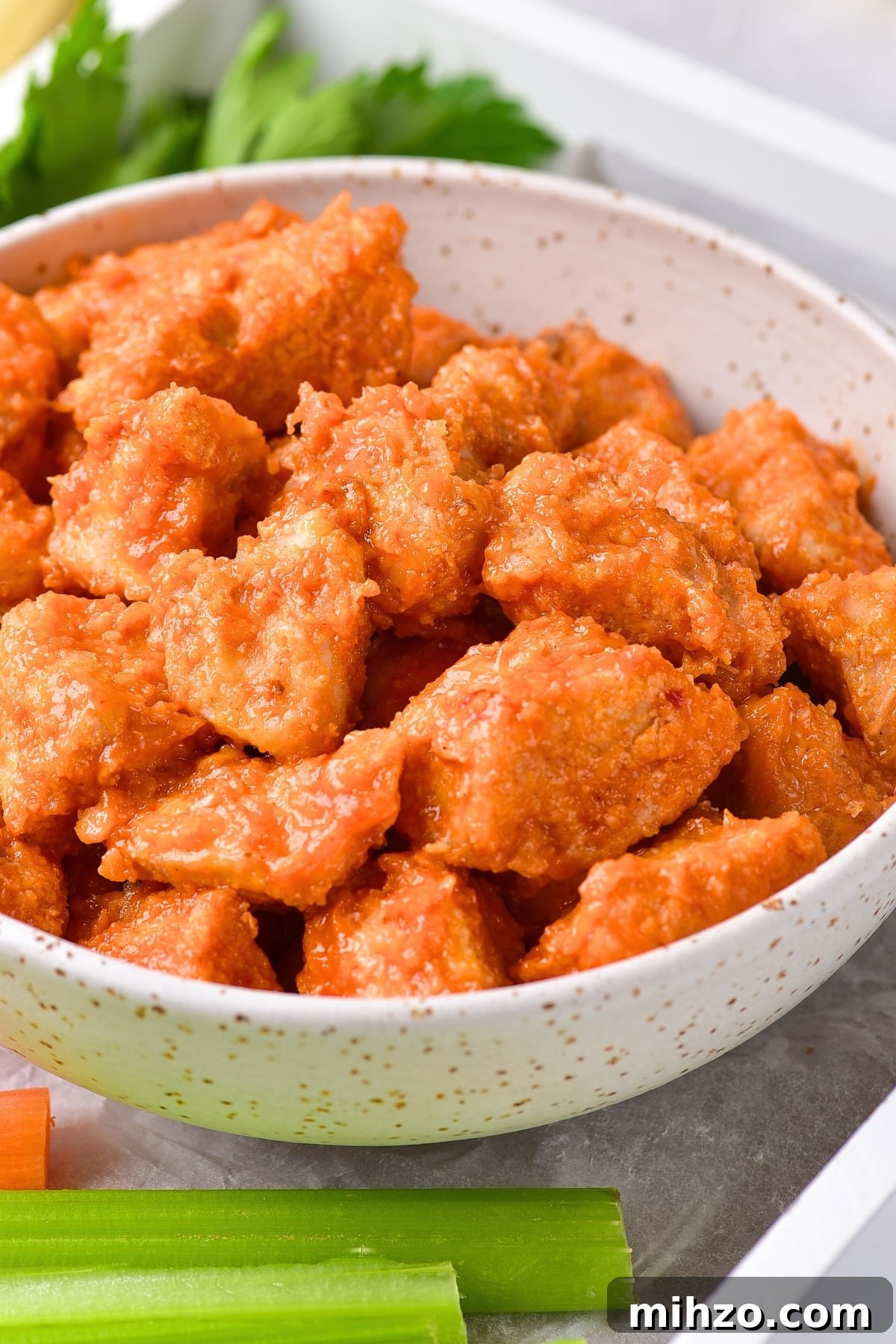 Gluten-Free Buffalo Chicken Bites in Air Fryer Up close shot of bowl of gluten-free buffalo chicken bites.