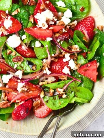 A bowl of strawberry spinach feta salad