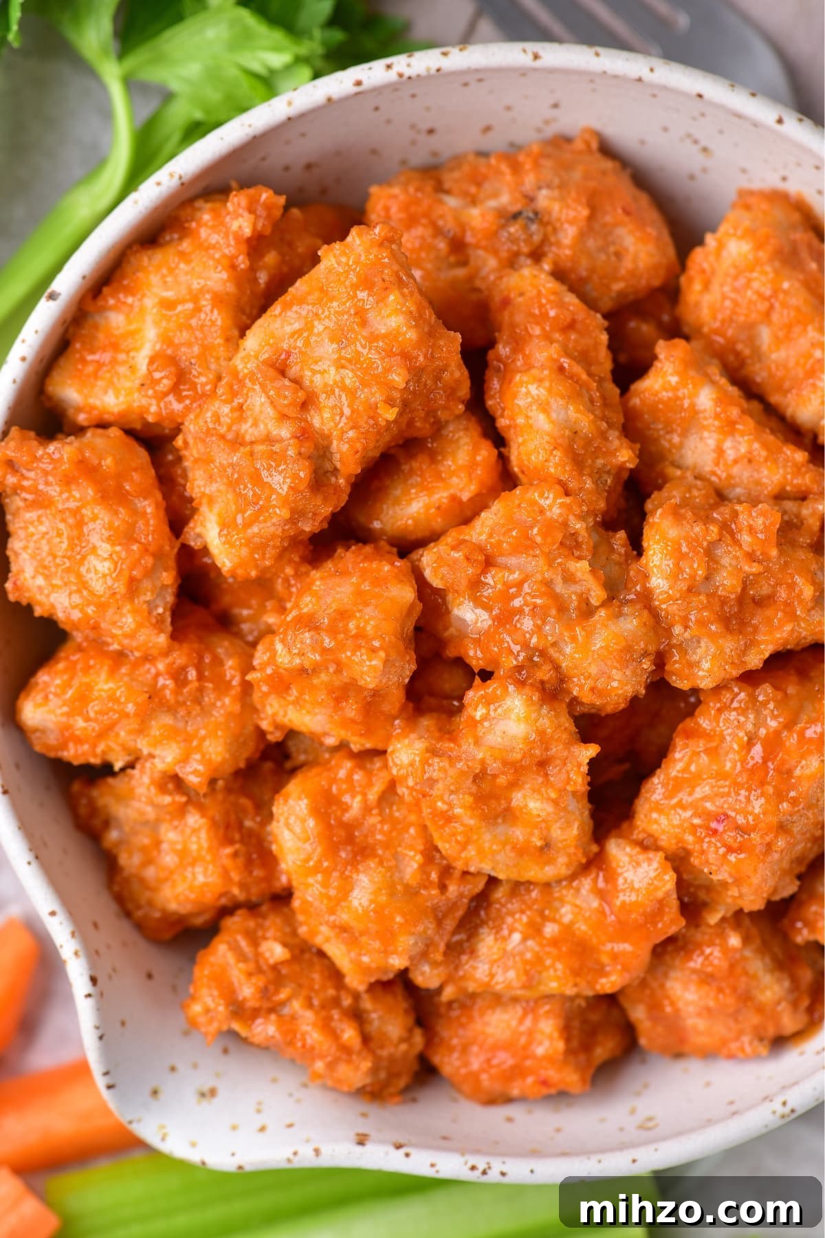 Buffalo Chicken Bites (Air Fryer) Up close shot of a bowl of buffalo chicken bites.
