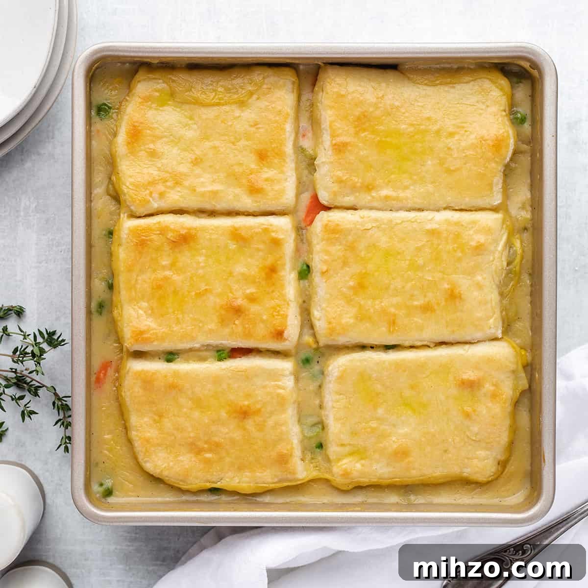 Hearty Vegetable Pot Pie Recipe with Flaky Crust 3 Vegetable Pot Pie in a baking dish after baking