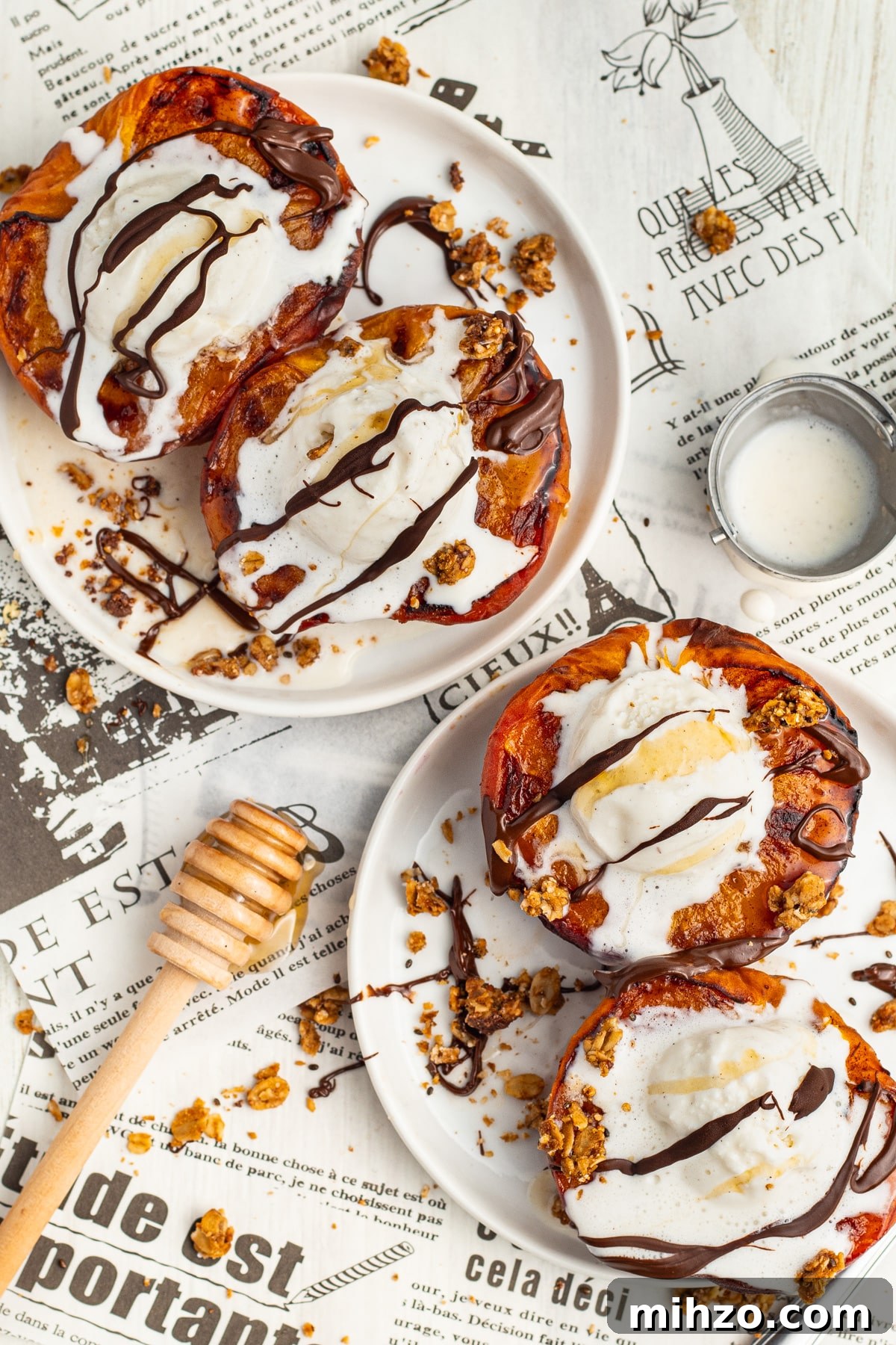 Crispy Air Fryer Peaches with Honey-Brown Sugar Glaze 3 Picture of two plates with air fryer peaches topped with ice cream, chocolate and honey.