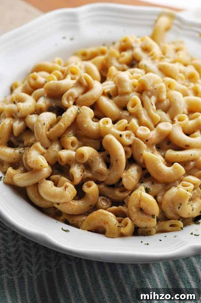 Zesty Pepper Jack Macaroni and Cheese Recipe: Creamy, Spicy Twist 5 Creamy Mac & Cheese with a spicy kick in white bowl
