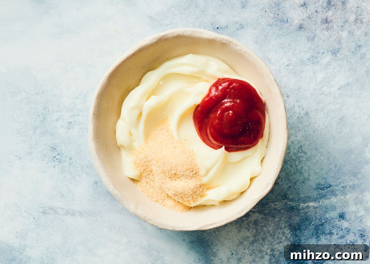 Quick Sriracha Aioli Recipe with 3 Ingredients 6 Sriracha aioli ingredients in a small bowl.