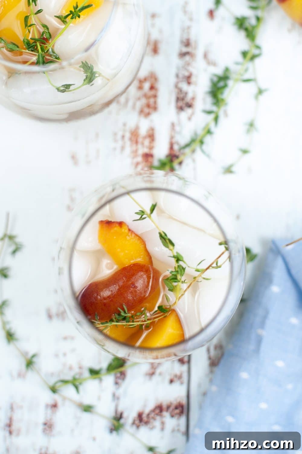 Image of peach cocktail recipe in a glass, shot from the top