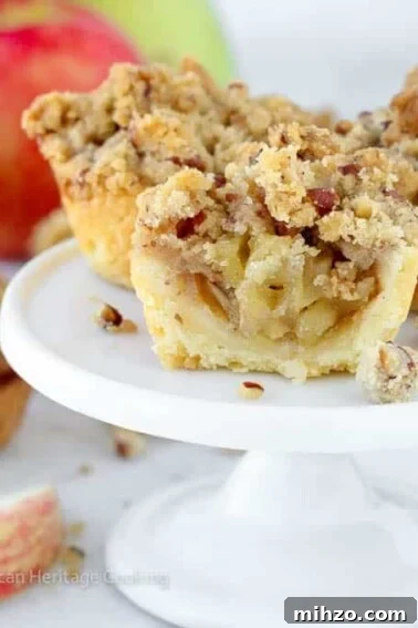 mini apple pies on white cake stand.
