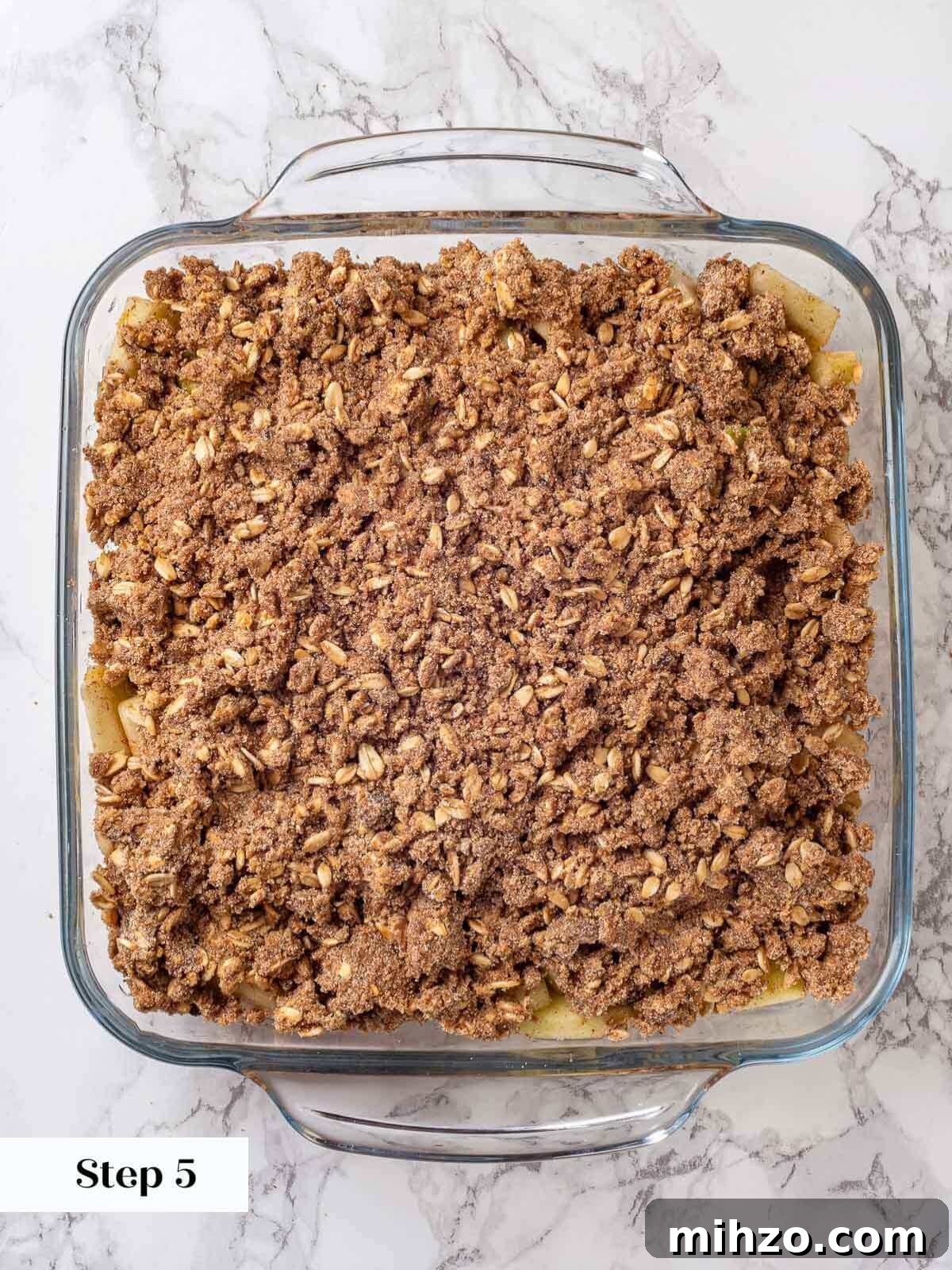 unbaked assembled apple crisp.