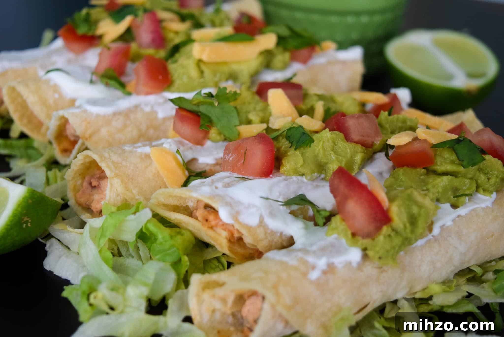 Crispy Baked Chicken Taquitos with Avocado Crema 6 Baked Chicken Taquitos close up view