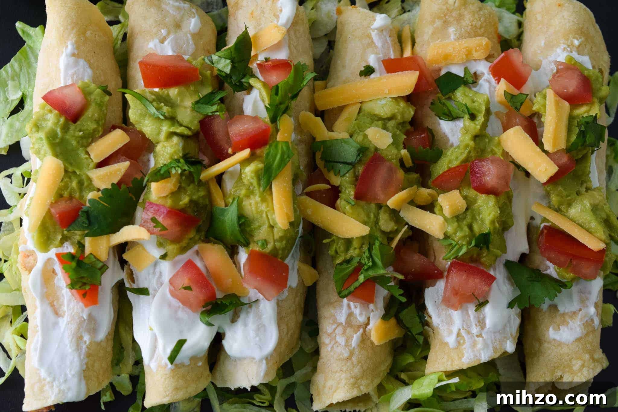 Crispy Baked Chicken Taquitos with Avocado Crema 7 Baked Chicken Taquitos overhead shot