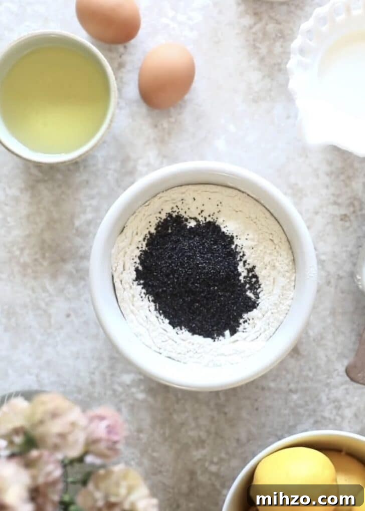 Ricotta Lemon Poppy Seed Muffins with Zesty Citrus Glaze 7 A bowl of flour and poppy seeds.