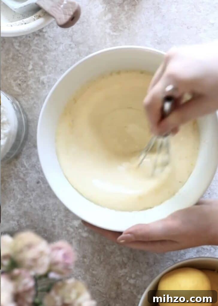 Ricotta Lemon Poppy Seed Muffins with Zesty Citrus Glaze 10 Whisking wet ingredients.