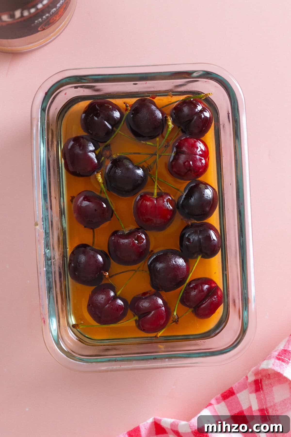Cherries soaking in brandy simple syrup