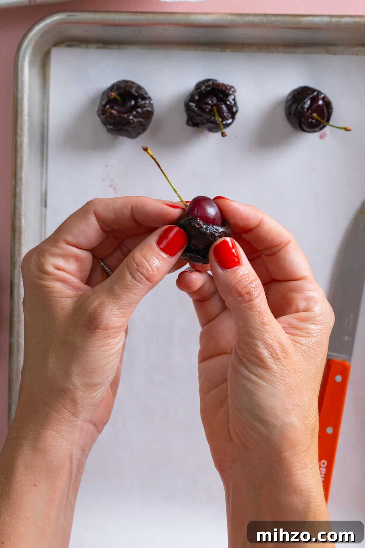 Stuffing prunes with brandy soaked cherries