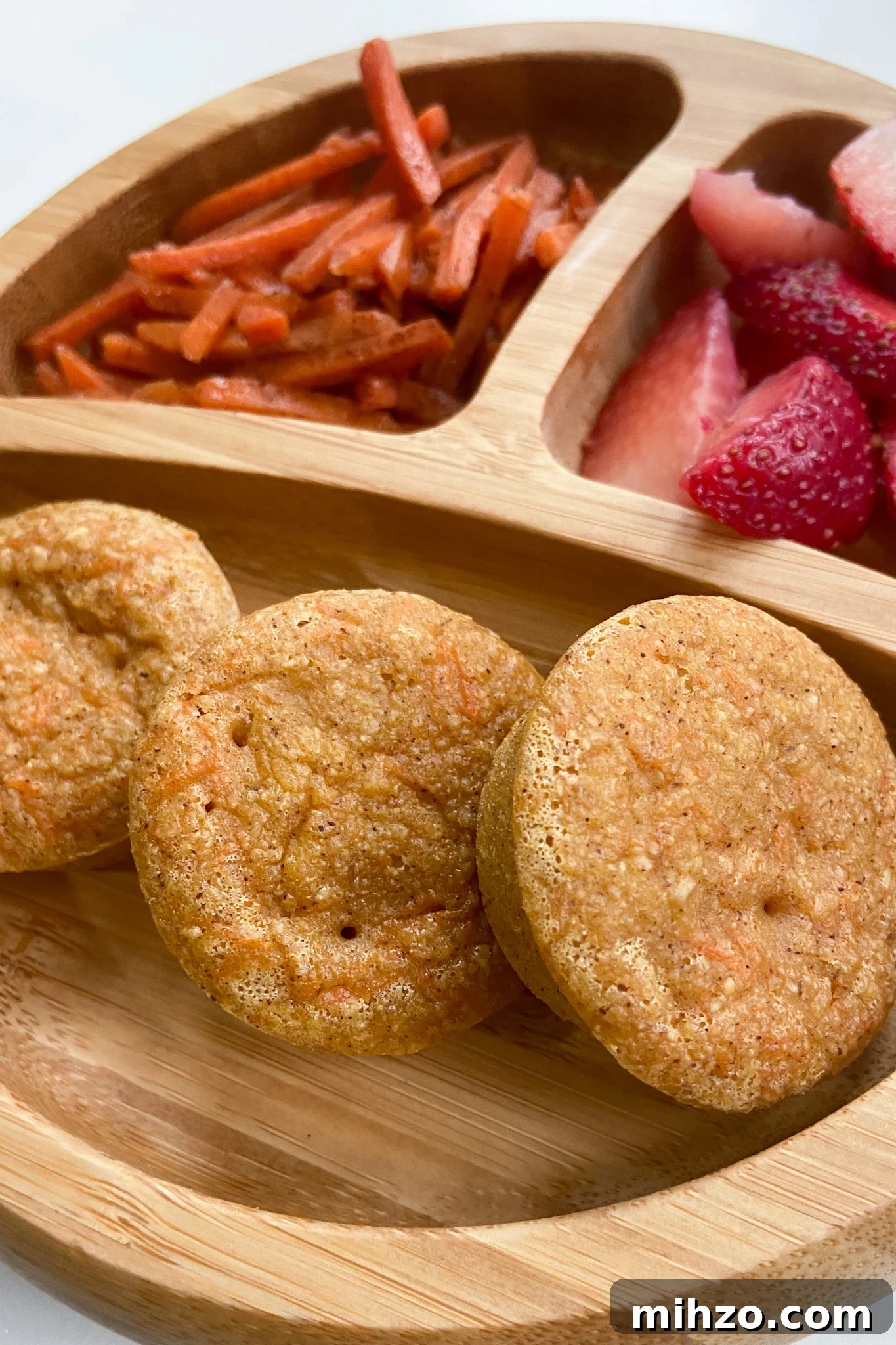 Gluten-Free Carrot Cake Muffins with Cream Cheese Swirl 5 Carrot cake muffins served with carrots and strawberries